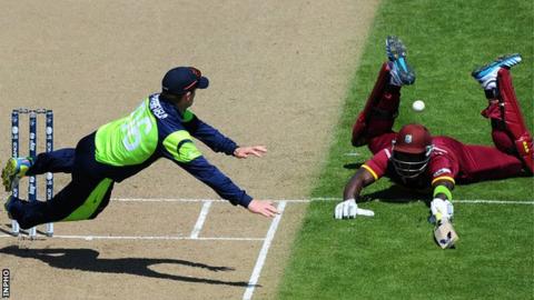 William Porterfield attempts to run out Darren Sammy as Ireland beat the West Indies at the 2015 World Cup