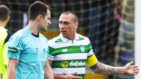 Referee Don Robertson and Celtic captain Scott Brown
