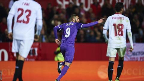 Karim Benzema celebrates scoring against Sevilla