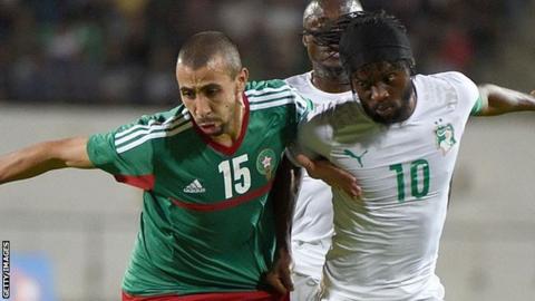Morocco's Fouad Chafik (left) vies for the ball with the Ivory Coast's Gervinho