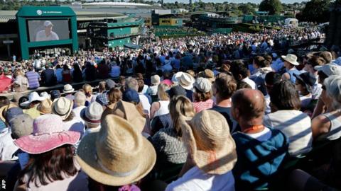 Fans watch Andy Murray from the sunny delights of Henman Hill