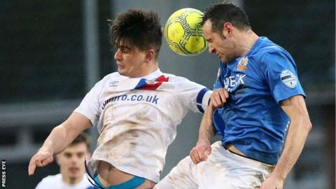 Jimmy Callacher and Ciaran Martyn in aerial action as Linfield beat Glenavon 2-1 in January