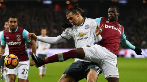 Pedro Obiang tussles for the ball with Zlatan Ibrahimovic of Manchester United