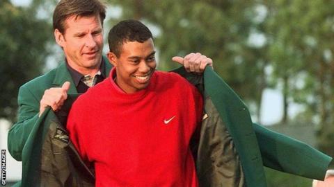Nick Faldo presents Tiger Woods with his first Masters Green Jacket in 1997