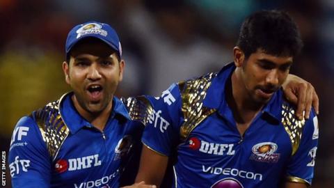 Mumbai Indians captain Rohit Sharma (left) with fastbowler Jasprit Bumrah, who took 3-7