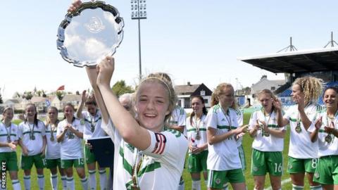 Emma McMaster lifts the silverware after the double success over Wales at the Super Cup NI
