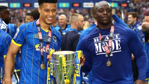 Adebayo Akinfenwa (right) celebrates