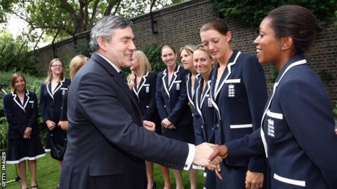 Ebony Rainford-Brent shakes hands with former UK Prime Minister Gordon Brown in 2009