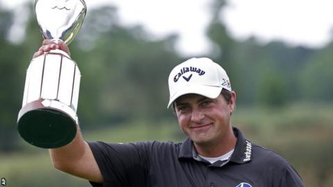 Brian Stuard celebrates with the Zurich Classic of New Orleans trophy