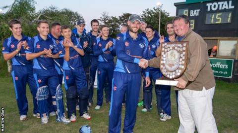Cobo captain Jamie Nussbaumer gets the Rozel Shield from his father, GCB chairman Dave Nussbaumer