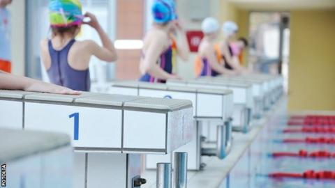 Children prepare for a swimming race