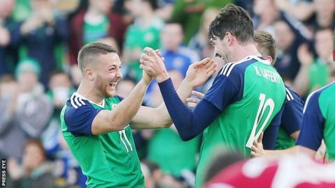 Conor Washington is congratulated by fellow goalscorer Kyle Lafferty at Windsor Park