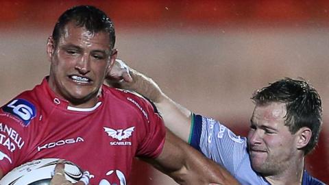 Aaron Shingler is tackled by Connacht's Kieran Marmion