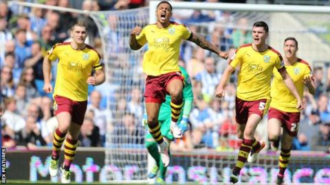 Andre Gray celebrates his goal for Burnley against Brighton