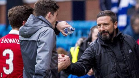 Aberdeen players are congratulated by manager Derek McInnes