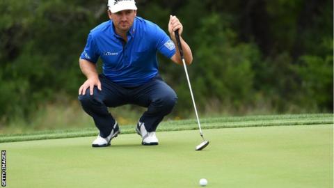 Graeme McDowell lines up a putt during the first round in San Antonio
