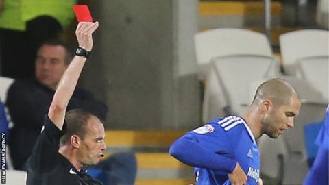 Matthew Connolly of Cardiff City is shown a red card