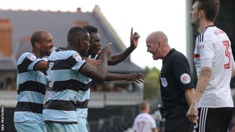 Karl Henry, Nedum Onuoha and Idrissa Sylla remonstrate with referee Lee Mason during QPR's 2-1 win over Fulham