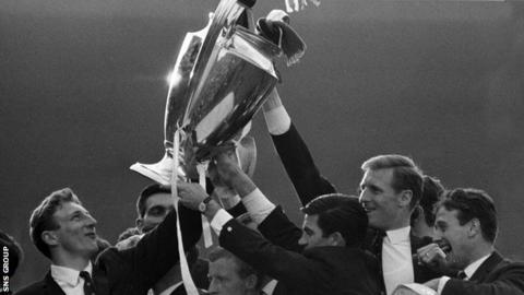 Celtic players show off the European Cup on their return to Glasgow
