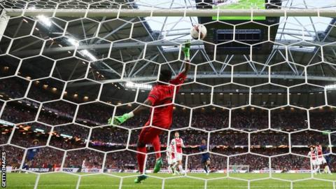 Paul Pogba's shot deflects into the Ajax net