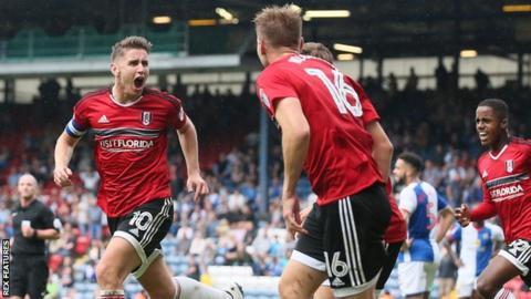 Tom Cairney celebrates his goal with Fulham teammates