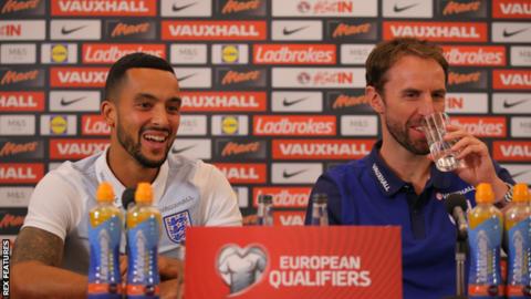 England forward Theo Walcott (left) with Gareth Southgate