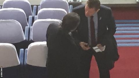 Steve Cotterill (r) talking to Nottingham Forest chairman Fawaz Al Hasawi