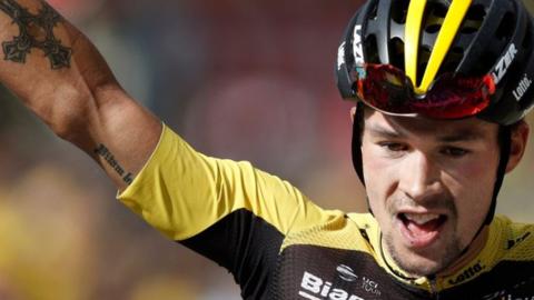 Primoz Roglic celebrates winning stage 17