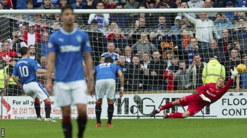 Rangers' Graham Dorrans fires a penalty past Motherwell's Trevor Carson