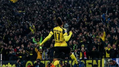 Pierre-Emerick Aubameyang jumps to celebrate after scoring