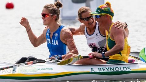 Dickins (centre) with fellow para-canoeists after the KL3 200m single final at the Rio Paralympics