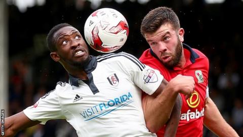 Moussa Dembele in action for Fulham against Blackburn Rovers' Grant Hanley
