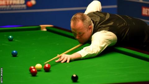 Higgins beats Gould to reach round two at Crucible