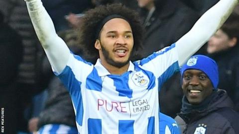 Isaiah Brown celebrates his first Huddersfield goal