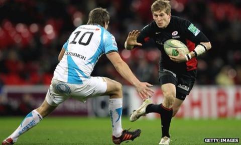 Saracens wing David Strettle tries to evade Ospreys fly-half Dan Biggar