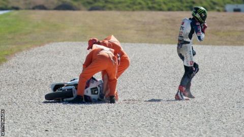 Chaz Davies walks away after sliding of during World Superbikes qualifying at Phillip Island