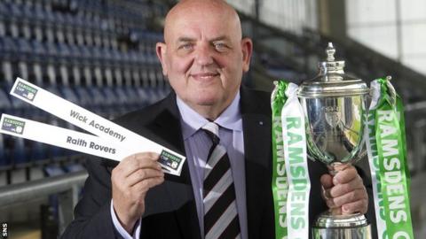 Wick first team coach Robert Mulheron helps to conduct the Ramsdens Cup first round draw