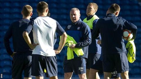 Ally McCoist oversees Rangers players in training