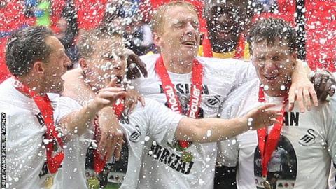 Swansea City celebrate promotion to the Premier League in May, 2011