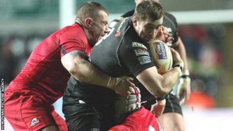 Ospreys try-scorer Morgan Allen is tackled by Edinburgh's John Yapp