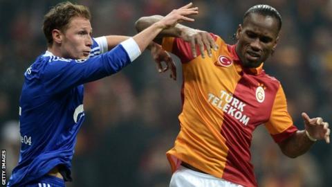 Benedikt Howedes and Didier Drogba