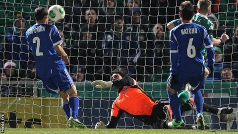 Israel keeper Dudu Aoute saved Steve Davis' close-range shot