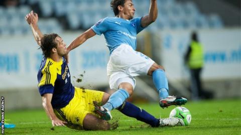 Swansea's Michu fouls Ricardinho