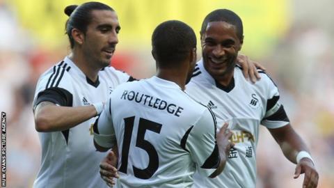 Wayne Routledge gets the Swansea congratulations