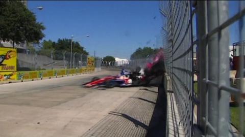 Dario Franchitti collides with Takuma Sato on the last lap of the IndyCar race in Houston
