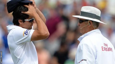 Alastair Cook queries a DRS decision with umpire Tony Hill