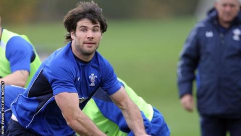 Mike Phillips being watched by Warren Gatland during a Wales training session