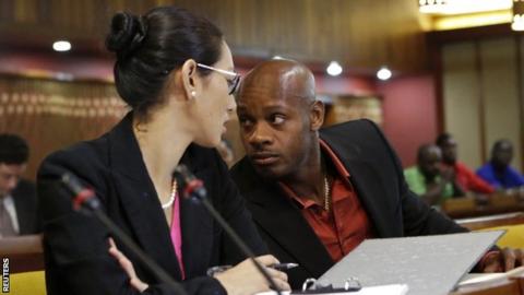 Asafa Powell with attorney Danielle Chai at his hearing