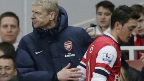 Arsene Wenger and Mesut Ozil of Arsenal