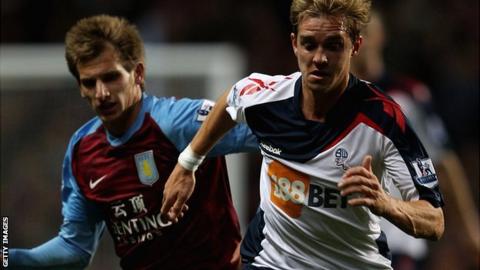 Stuart Holden (right) in action for Bolton